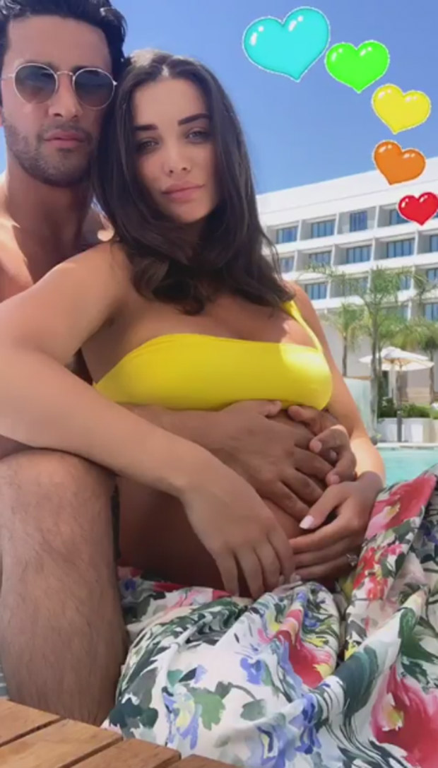 HOT! Amy Jackson looks radiant in this yellow bralet as she flaunts her pregnancy glow during her latest exotic vacation