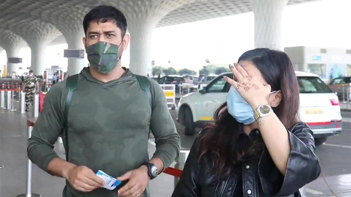 MS Dhoni with wife spotted at Airport MS Dhoni with wife spotted at Airport