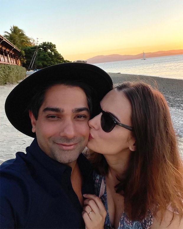 Evelyn Sharma gives a sweet kiss to her husband Tushaan Bhindi whilst