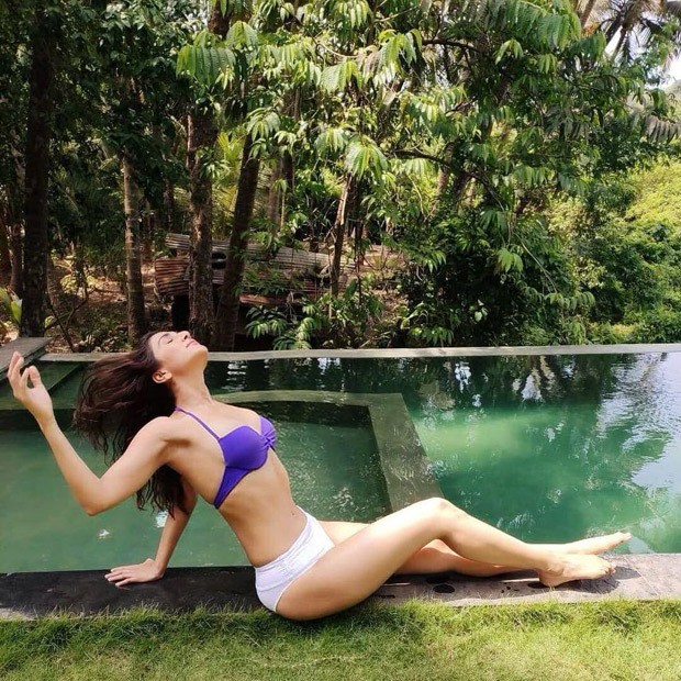 Vaani-Kapoor-sizzles-in-purple-top-and-white-bikini-bottom-1.jpg