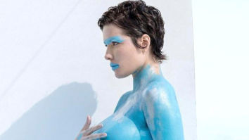 Halsey cradles her baby bump in topless photo covered in body paint for Allure magazine