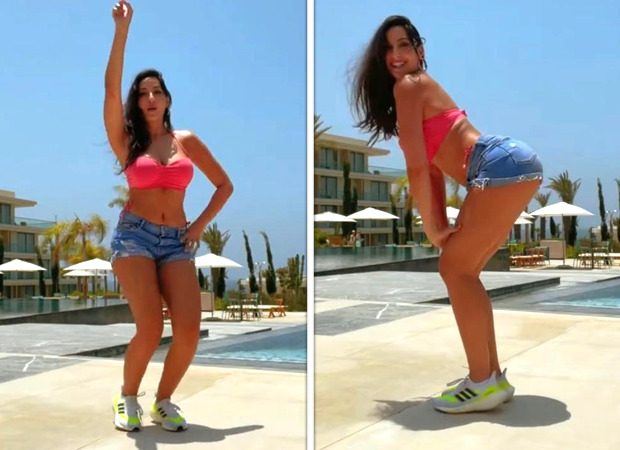 Nora-Fatehi-dons-pink-bikini-top-and-blue-denim-shorts-as-she-takes-on-Drake%E2%80%99s-%E2%80%98One-Dance%E2%80%99-challenge.jpeg