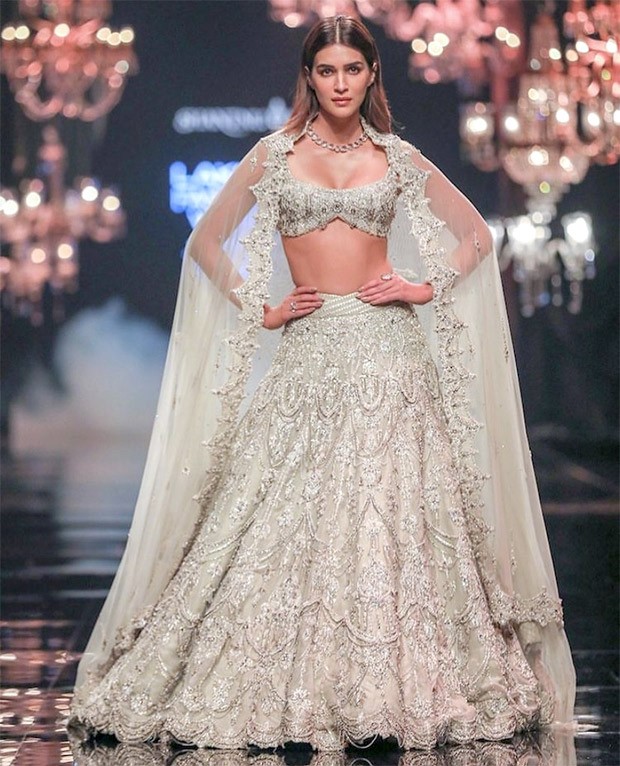 Kriti Sanon rules the runway on the opening day of FDCI X Lakmé Fashion Week 2022 while donning a glittering ivory lehenga by Shantanu & Nikhil